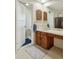 Bathroom showcasing a vanity with storage, ample counter space, and a separate toilet area at 4967 E Lake Ave, Centennial, CO 80121