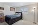 Bedroom featuring dark wood furniture, a window, and minimalist decor at 4967 E Lake Ave, Centennial, CO 80121