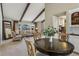 Open floorplan showcasing dining and living room with large window, hardwood floors, and neutral color palette at 4967 E Lake Ave, Centennial, CO 80121
