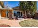 Inviting front porch with outdoor seating and fire pit, perfect for relaxing and enjoying the neighborhood at 4967 E Lake Ave, Centennial, CO 80121