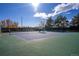 Community tennis courts surrounded by lush trees and foliage at 4967 E Lake Ave, Centennial, CO 80121