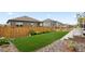 Backyard featuring a lush lawn and garden beds at 14075 Scarlet Sage St, Parker, CO 80134