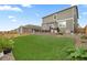 Large grassy backyard featuring beautiful landscaping at 14075 Scarlet Sage St, Parker, CO 80134
