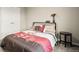 Bedroom with plush carpet, white trim, modern decor, and neutral walls at 14075 Scarlet Sage St, Parker, CO 80134