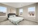 Light-filled bedroom with serene paint, plush carpet and neighborhood views at 14075 Scarlet Sage St, Parker, CO 80134