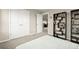 Open bedroom with a bookshelf, plush carpet, and double closets at 14075 Scarlet Sage St, Parker, CO 80134