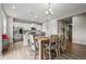 Dining room with wood table and chairs next to open kitchen at 14075 Scarlet Sage St, Parker, CO 80134