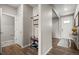 A well decorated entryway includes a coat rack, shoe storage, and a view of the powder room at 14075 Scarlet Sage St, Parker, CO 80134