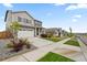 A two-story home is situated on a street with manicured lawns and sidewalks at 14075 Scarlet Sage St, Parker, CO 80134