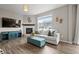 Comfortable living room with a fireplace, TV, and a cozy couch at 14075 Scarlet Sage St, Parker, CO 80134