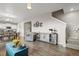 Open concept living room featuring stairs and kitchen at 14075 Scarlet Sage St, Parker, CO 80134