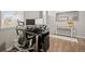 Home office includes a desk and chair with engineered wood floors at 14075 Scarlet Sage St, Parker, CO 80134