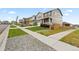 Exterior view of a home situated on a tree-lined street at 14075 Scarlet Sage St, Parker, CO 80134