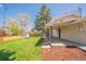 Expansive backyard with a covered patio and newly installed wooden fence at 11383 W 28Th Ave, Lakewood, CO 80215