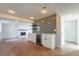 Finished basement featuring a fireplace, a kitchenette, and luxury vinyl plank floors at 11383 W 28Th Ave, Lakewood, CO 80215