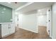 Finished basement featuring a kitchenette, luxury vinyl plank floors and a door leading to the backyard at 11383 W 28Th Ave, Lakewood, CO 80215