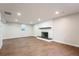 Finished basement featuring a fireplace and luxury vinyl plank floors at 11383 W 28Th Ave, Lakewood, CO 80215