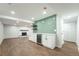 Finished basement featuring a fireplace, a kitchenette, and luxury vinyl plank floors at 11383 W 28Th Ave, Lakewood, CO 80215