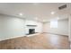 Finished basement featuring a fireplace and luxury vinyl plank floors at 11383 W 28Th Ave, Lakewood, CO 80215
