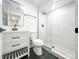 Modern bathroom with a glass-enclosed shower, sleek vanity, and contemporary fixtures at 11383 W 28Th Ave, Lakewood, CO 80215