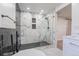 Elegant bathroom featuring a walk-in shower with marble tile at 11383 W 28Th Ave, Lakewood, CO 80215