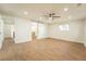 Open concept bedroom with hardwood floors, large windows for natural light, and access to a walk-in closet at 11383 W 28Th Ave, Lakewood, CO 80215