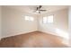 This spacious bedroom has two windows with wood floors and a ceiling fan at 11383 W 28Th Ave, Lakewood, CO 80215