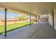 Covered patio with concrete flooring and a view of the manicured backyard at 11383 W 28Th Ave, Lakewood, CO 80215