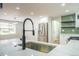 Modern kitchen featuring a stainless steel sink, matte black faucet, and stainless steel appliances at 11383 W 28Th Ave, Lakewood, CO 80215