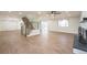 Spacious living room with a staircase, fireplace and an open floor plan into the kitchen at 11383 W 28Th Ave, Lakewood, CO 80215