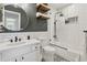Chic bathroom with subway tile, modern fixtures, and open shelving for towels at 4978 Camel Heights Rd, Evergreen, CO 80439