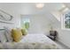 Bright bedroom with a comfortable bed, plush pillows, and serene window views at 4978 Camel Heights Rd, Evergreen, CO 80439