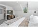 Comfortable bedroom featuring stylish furniture, television, and closet at 4978 Camel Heights Rd, Evergreen, CO 80439