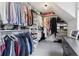 Spacious walk-in closet with organized shelves and hanging rods for ample storage at 4978 Camel Heights Rd, Evergreen, CO 80439