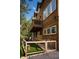Back of the home with a balcony, patio, and backyard at 4978 Camel Heights Rd, Evergreen, CO 80439