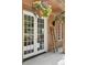 Charming entryway with a decorative ladder and vibrant flowers, perfect for adding a touch of rustic elegance at 4978 Camel Heights Rd, Evergreen, CO 80439