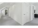 Hallway with carpet, white walls, and access to rooms at 4978 Camel Heights Rd, Evergreen, CO 80439