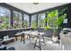 Bright home office with a plant and lots of natural light through the windows at 4978 Camel Heights Rd, Evergreen, CO 80439