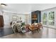 Stylish living room featuring a fireplace, hardwood floors, and French doors, perfect for entertaining guests at 4978 Camel Heights Rd, Evergreen, CO 80439