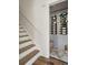 Stairway to wine cellar with wall mounted racks and herringbone flooring at 4978 Camel Heights Rd, Evergreen, CO 80439