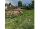 Large backyard with dirt pile, perfect for landscaping at 1105 S Raleigh St, Denver, CO 80219