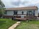 Modest single-story home featuring a small front porch and a weathered facade, in need of some TLC at 1105 S Raleigh St, Denver, CO 80219
