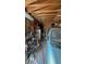 Spacious garage with wooden beams and ample storage, next to a blue van at 1105 S Raleigh St, Denver, CO 80219