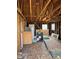 A home's interior undergoing renovation, revealing exposed framing and stored appliances at 1105 S Raleigh St, Denver, CO 80219