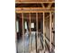 View of a home's framing, renovation in progress, with wooden studs and exposed ceilings at 1105 S Raleigh St, Denver, CO 80219