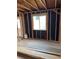 Interior under renovation; construction supplies, exposed framework, and a visible window frame at 1105 S Raleigh St, Denver, CO 80219