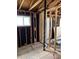 Incomplete interior renovation reveals exposed plumbing, wall studs and subflooring, creating a fixer-upper's dream at 1105 S Raleigh St, Denver, CO 80219