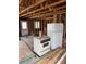 Picture of a vintage stove and refrigerator in a home under construction, showcasing its remodeling potential at 1105 S Raleigh St, Denver, CO 80219