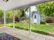 Charming backyard with a cozy fire pit area, garden shed, lush lawn, and string lights for a warm ambiance at 6223 Gray St, Arvada, CO 80003