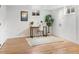 Finished basement features wood laminate flooring, a modern desk, and bright natural light at 6223 Gray St, Arvada, CO 80003
